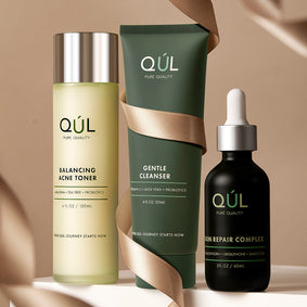 QUL Beauty Gentle Cleanser Swatch with bundle products: balancing acne toner and skin repair complex wrapped with a ribbon